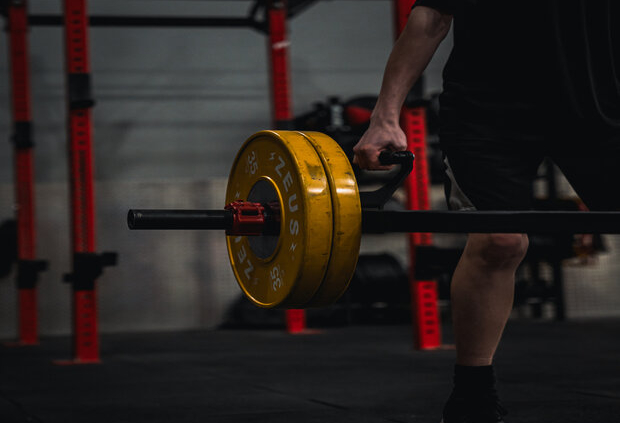 a person holding a barbell